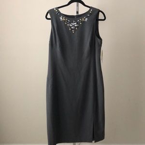 Grey dress with cut glass piece in front of dress